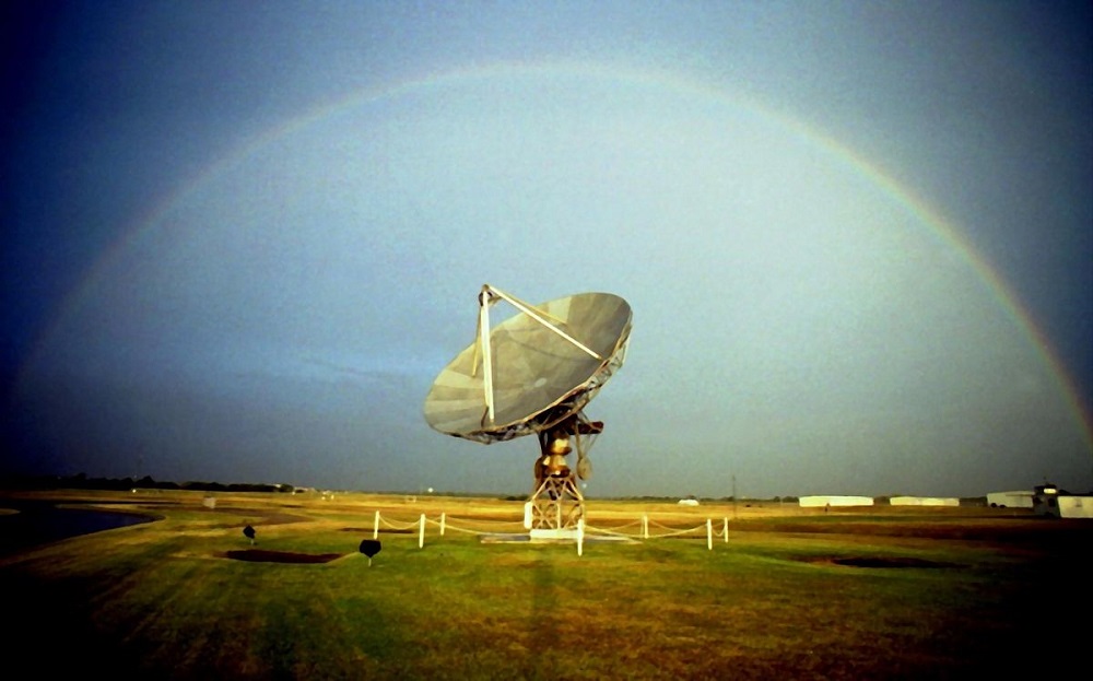 A rainbow arching over the WSR-88D test radar. At the NSSL site in Oklahoma, Norman. 2004 September 23.